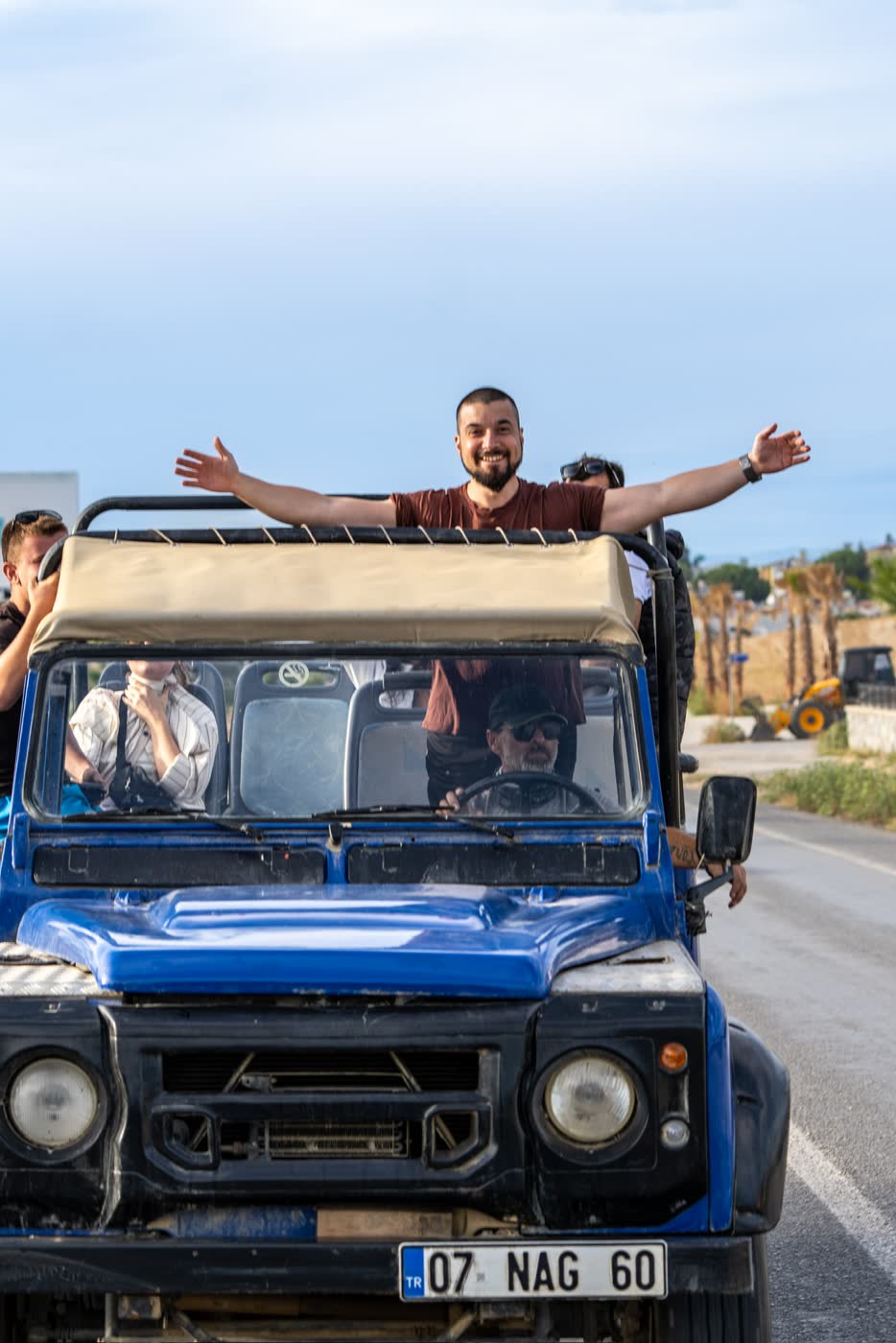 Koray welcoming the group from the top of a safari jeep